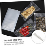 Clear vacuum roll bags with several sample sealed packages of nuts, red chilies, and sunflower seeds