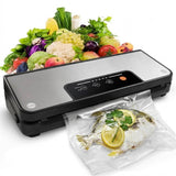 A vacuum sealer with a clear bag containing a fish and lemon slices, fresh vegetables & fruits are piled 