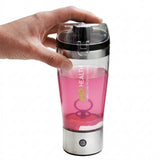 Protein shaker bottle with a black lid and a pink liquid inside