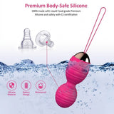 A pink silicone waterproof personal massager with a long pink loop handle  