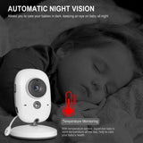 A baby security camera shown a sleeping baby, with text automatic night vision & temperature monitoring features