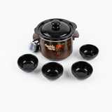 A ceramic choclate making pot with four small bowls