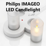 Philips IMAGEO LED candlelight set with a white charging base, frosted glass holders, and a lit candle 