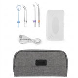 Dental oral irrigator kit with four nozzle tips, USB charging cable, a translucent protective case, and a grey pouch